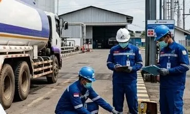 TIK staff overseeing a fuel transfer from a tanker truck
